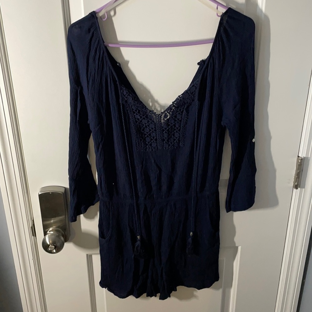 Linen romper with pockets.